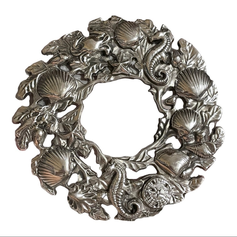 SEA life nautical circular aluminum cast trivet.